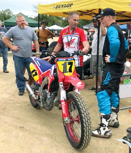 Turner Racing Team Manager Bryan Bigelow (center) talks things over with Chase Saathoff (right) and his dad, Mike Saathoff, before Saathoff climbed on the Turner Racing Honda for the Springfield short track races in September. A month later Saathoff made it official that he will race for Turner in the Progressive American Flat Track Series when he turns pro next season.